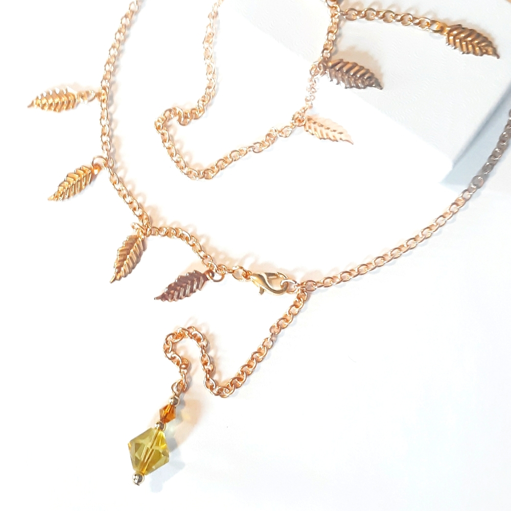 Gold Feather Pendant Necklace And Bracelet